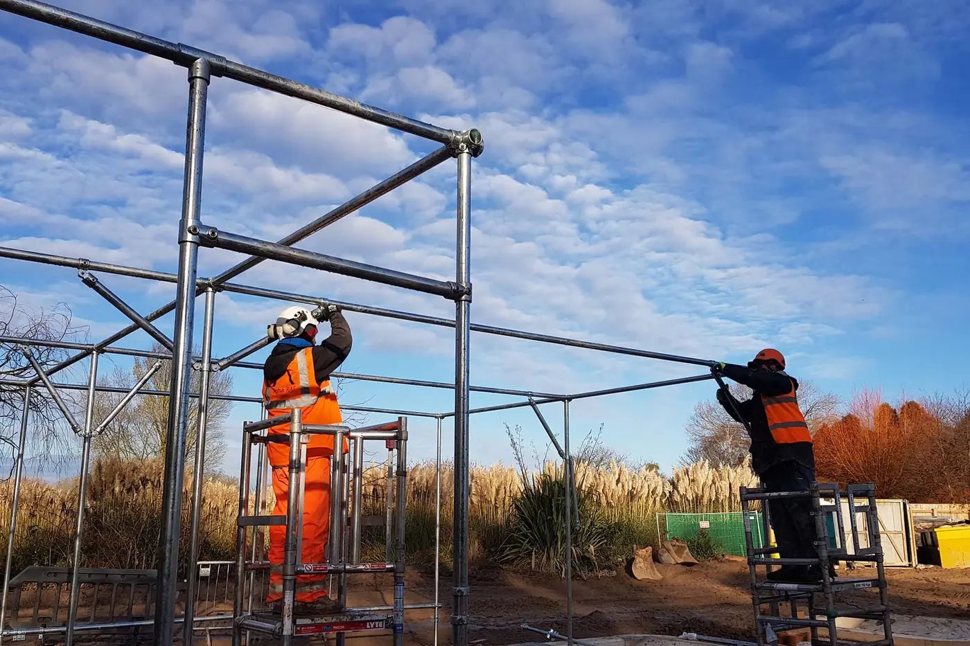 Industrial abseiling contractor installing steel framework