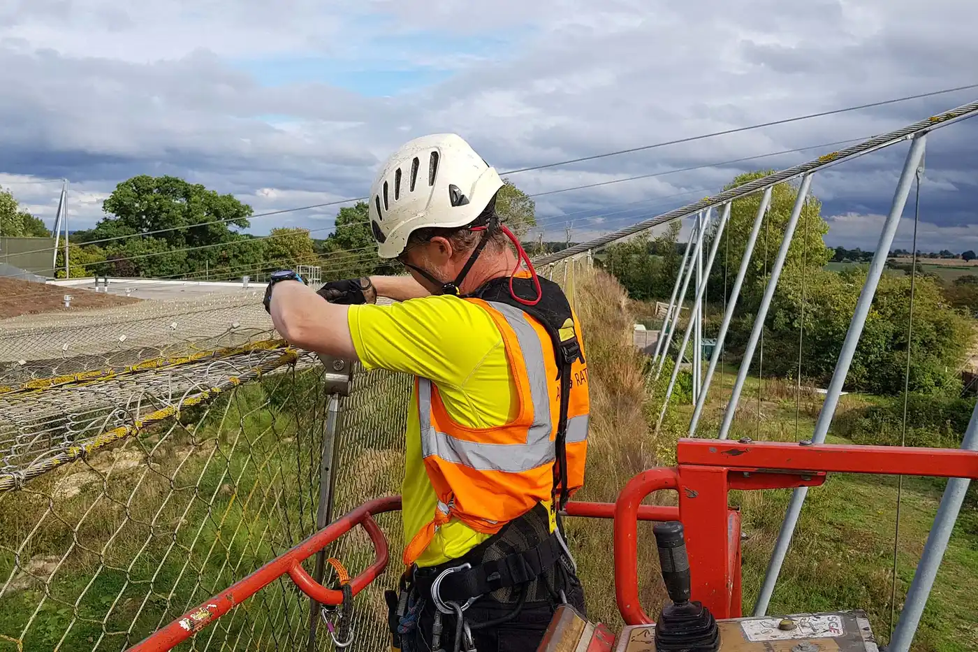 Industrial abseiling contractor installing steel framework